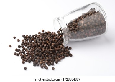 Black Peppercorns Falling Out From A Glass Jar, Indian Spice