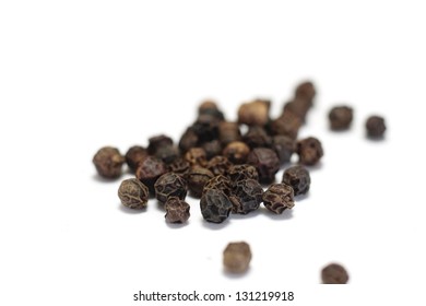 Black Peppercorns Isolated On White