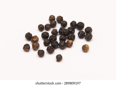 Black Peppercorns Isolated On White Background