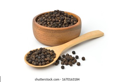 Black peppercorns (Black pepper) in wooden bowl isolated on white background. - Shutterstock ID 1670163184
