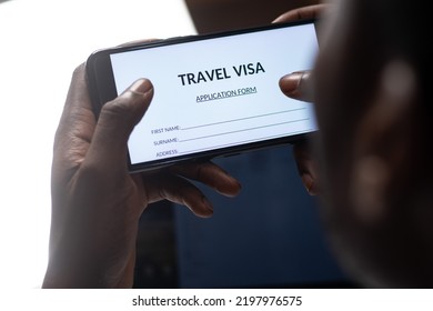 Black Person Filling Travel Visa Application On A Phone