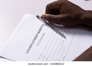 Black Person Filling Unemployment Benefit Form