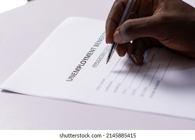 Black Person Filling Unemployment Benefit Form