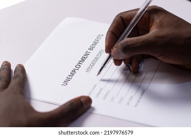 Black Person Filling Unemployment Benefit Form