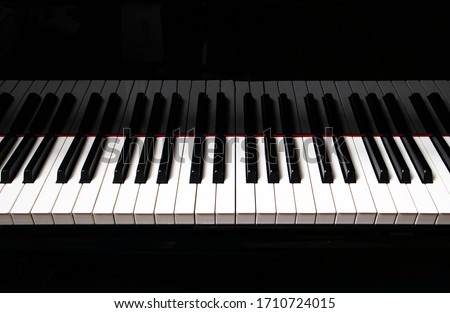 black piano and piano keyboard