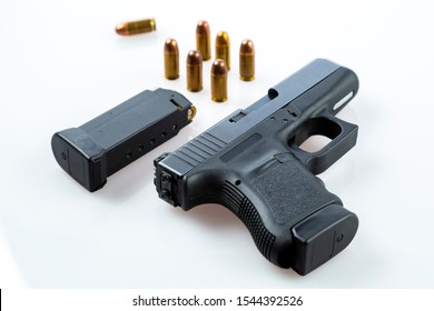 black pistol with .45 ACP bullets