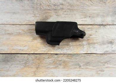 Black Pistol Holster On The Table