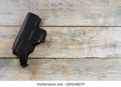 Black Pistol Holster On The Table