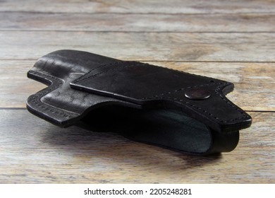 Black Pistol Holster On The Table