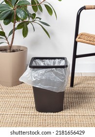 Black Plastic Bucket With Bag. Cleanliness In The House. Trash Can For Kitchen, Living Room Or Bathroom