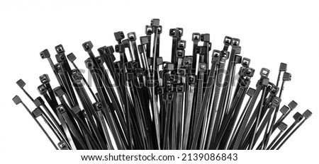 Black plastic cable ties isolated on white background. plastic wire ties closeup.