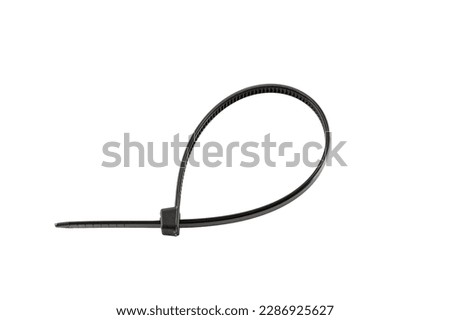 Black plastic cable ties isolated on white background. plastic wire ties close-up.
