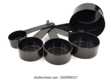 Black Plastic Coffee Measuring Cup In Multiple Sizes Isolated On White Background