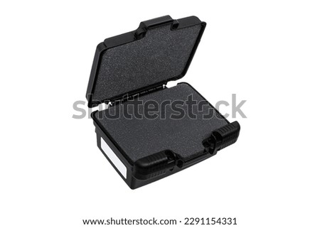 Black plastic container with foam inside for safe storage and transportation of fragile and expensive items. Sturdy plastic case. Isolate on a white background.
