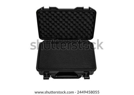 Black plastic container with foam inside for safe storage and transportation of fragile and expensive items. Sturdy plastic case. Isolate on a white background.