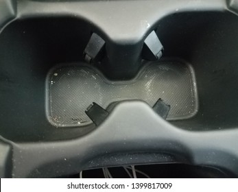 Black Plastic Cupholder In Car With Dirt Or Grime