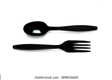 Black Plastic Cutlery Knife Fork Spoon Isolated On White Background Low Highlight. For Kitchen Restaurant And Table Set Up. Concern To Plastic Conservative Recycle Items And One Time Use Utensils