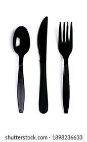 Black Plastic Cutlery Knife Fork Spoon Isolated On White Background Low Highlight. For Kitchen Restaurant And Table Set Up. Concern To Plastic Conservative Recycle Items And One Time Use Utensils