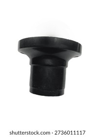 Black plastic electrical fitting isolated on white background. Industrial electrical connector or lamp holder component made of durable insulating plastic. Used for electrical installation, lighting fixture assembly, and wiring accessories. Simple cylindrical design with flange for stable mounting. Suitable for household and industrial electrical applications.