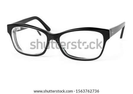 Black plastic eyeglasses frames with clear lens isolated on white background, trendy optical frame, spectacles with shiny black frame for reading, to a person with visual impairment
