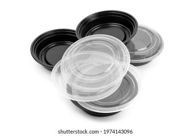 black plastic food take out containers used by food delivery app companies isolated on white
