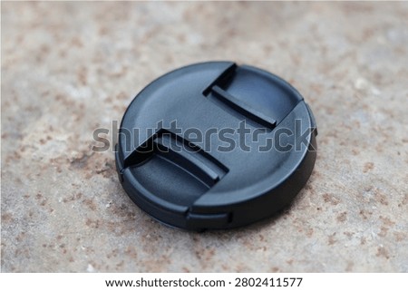 Black plastic lens cap for lens and camera safety