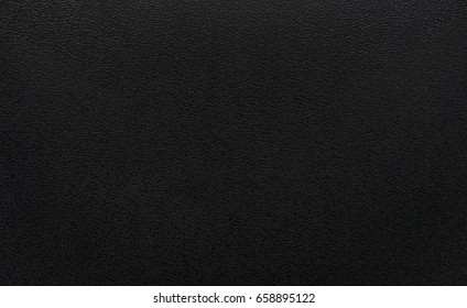 Black plastic texture background. Dark rough material in pvc object.