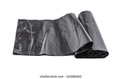 black plastic trash bags isolated on white background