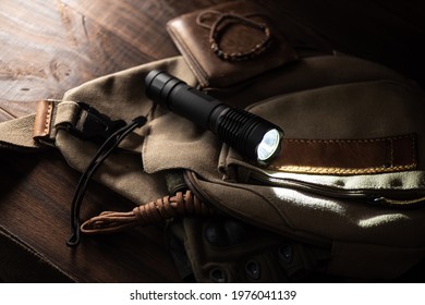 Black pocket flashlight for Everyday Carry (EDC).