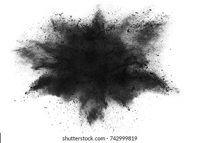 Black powder explosion isolated on white background, charcoal like particles concept.
