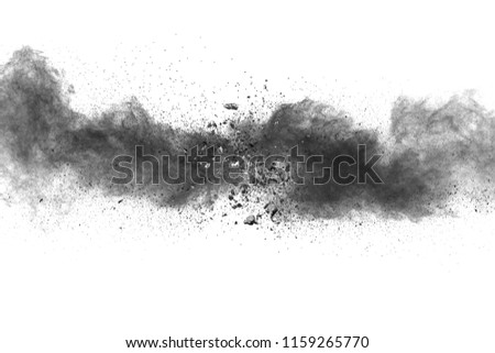 Black powder explosion on white background. Black dust splash.