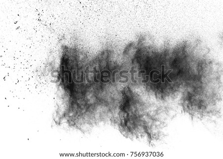 Black powder explosion. The particles of charcoal splatter on white background. Closeup of black dust particles splash isolated on  background. Imagine de stoc © 