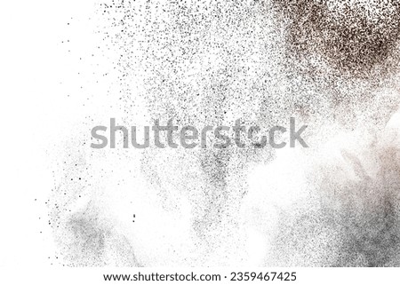 Black powder splatter background.Dust particles texture. Grunge urban backdrop.