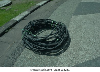 Black Power Cord That Was Coiled Up And Lying On The Bottom.