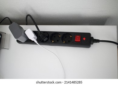 Black Power Strip With Sockets On The Table