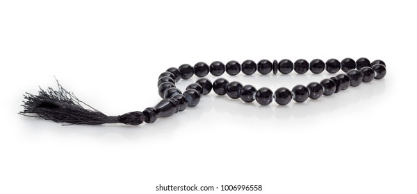 Black prayer beads with 33 knots made of stone on a matte surface on a white background