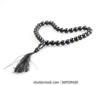 Black prayer beads in the shape of a heart (isolated on white)