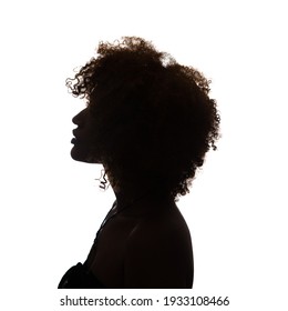 Black profile of an African woman on a white background, shaded silhouette, head and shoulders. - Shutterstock ID 1933108466