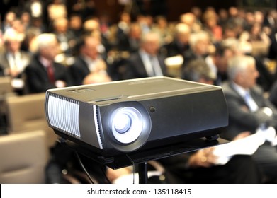 Black Projector For Business Presentation In The Foreground