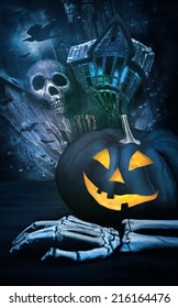 Black pumpkin with skeleton hand against eerie background - Shutterstock ID 216164476