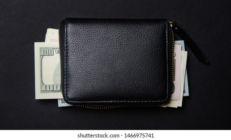 Black Purse In Which Dollars Lie. Money. A Doller Bills In A Wallet