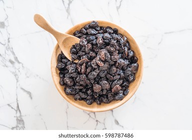 Black Raisins In Bowl On Table