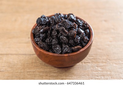 Black Raisins In Bowl On Table