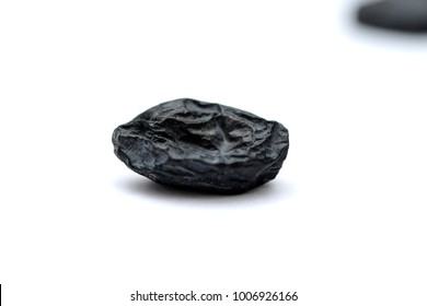 Black Raisins On White Background