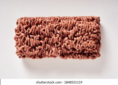 Black Of Raw Plant Based Minced Vegan Meat Substitute On A White Background In An Overhead View