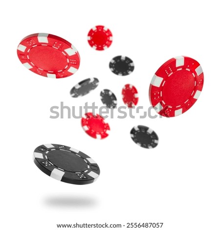 Black and red casino chips falling on white background