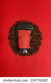 Black Red Coffee Packaging Mockup And Coffee Beans On Red Background. Top View Coffee Packaging Concept Mockup. Red Coffee Mock-up.