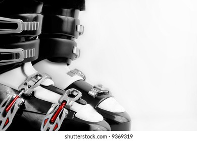 Black And Red Ski Boots Over White Background