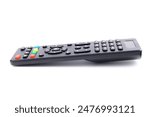 black remote control with colored buttons for tv, side view, close-up, isolated on white background