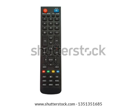 The black remote control has a button to control the TV on a white background and cliping path.